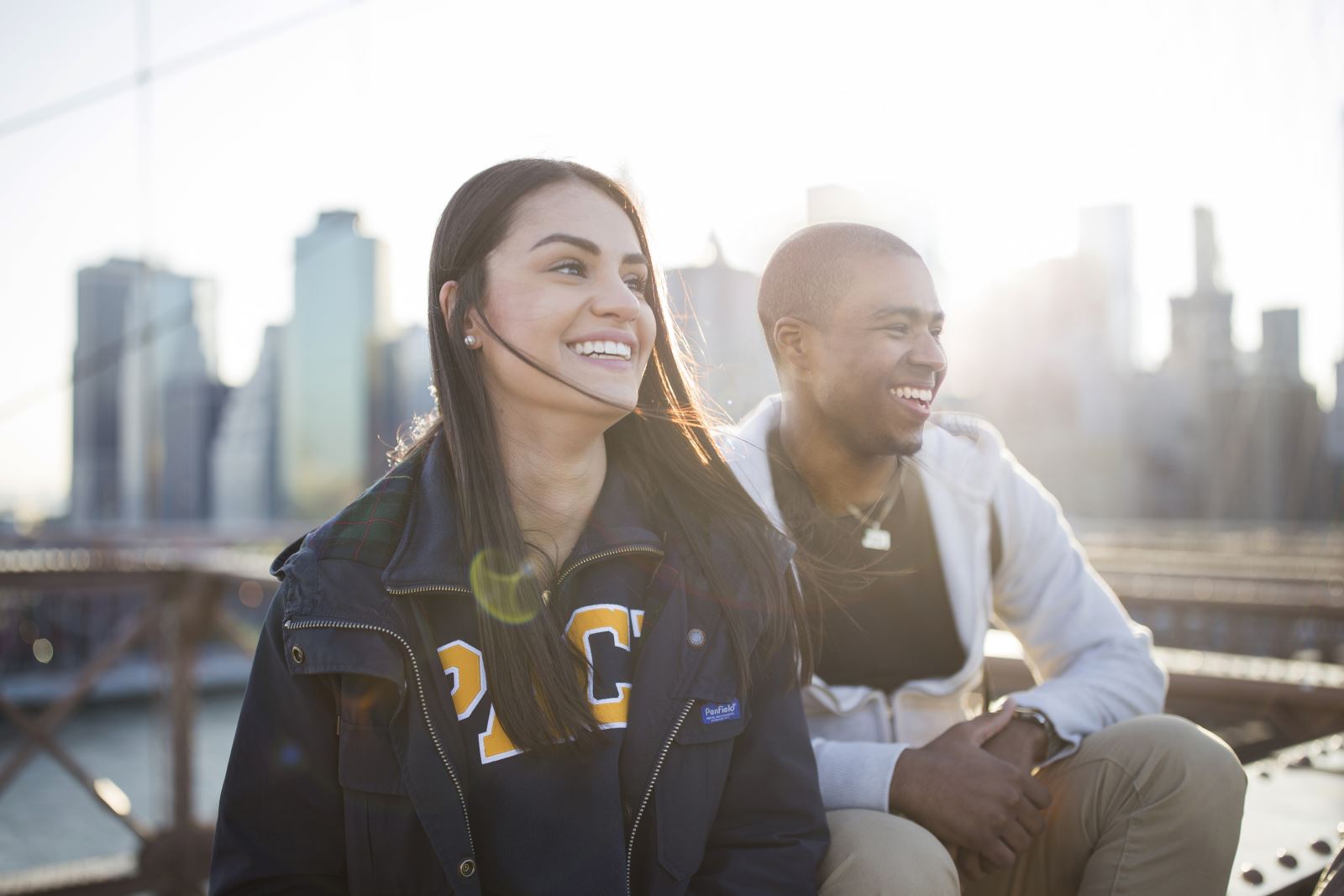 Two students in front of skyline